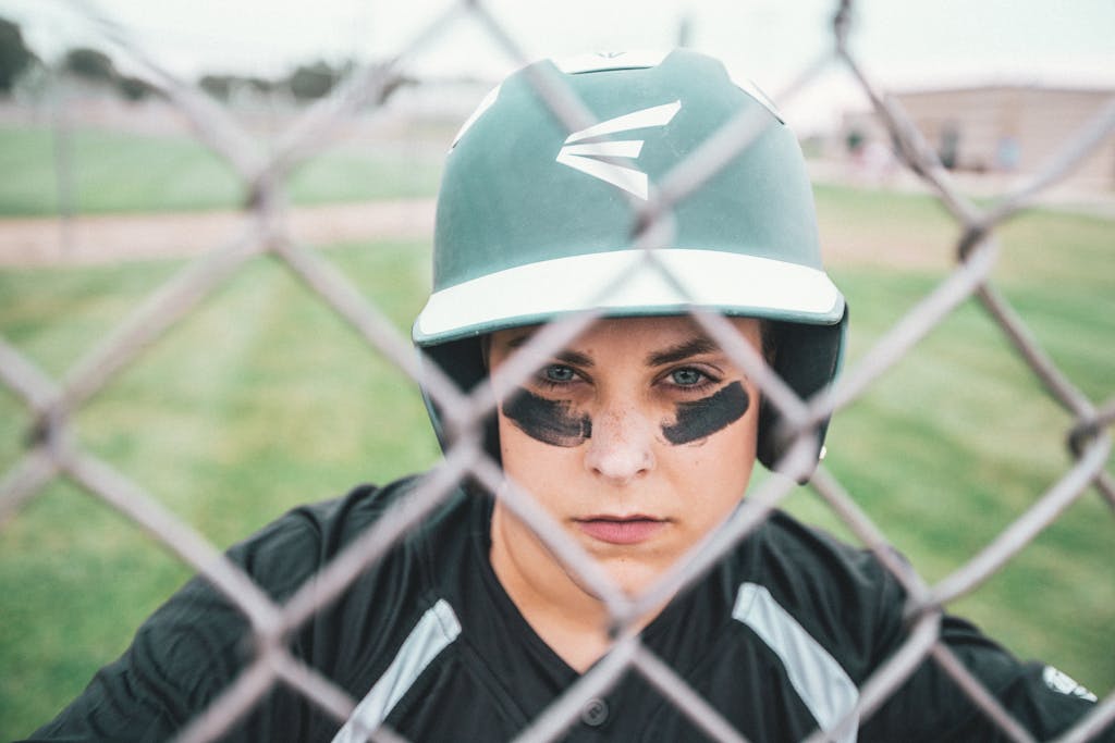 Close-up of a baseball player wearing a helmet, focused and ready.
