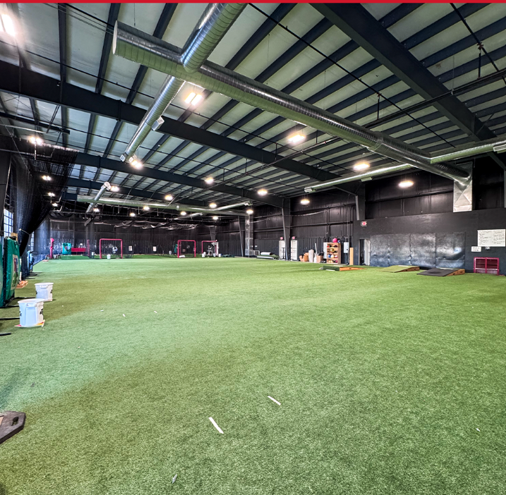 Indoor turf training area at The EDGE Baseball Training Facility